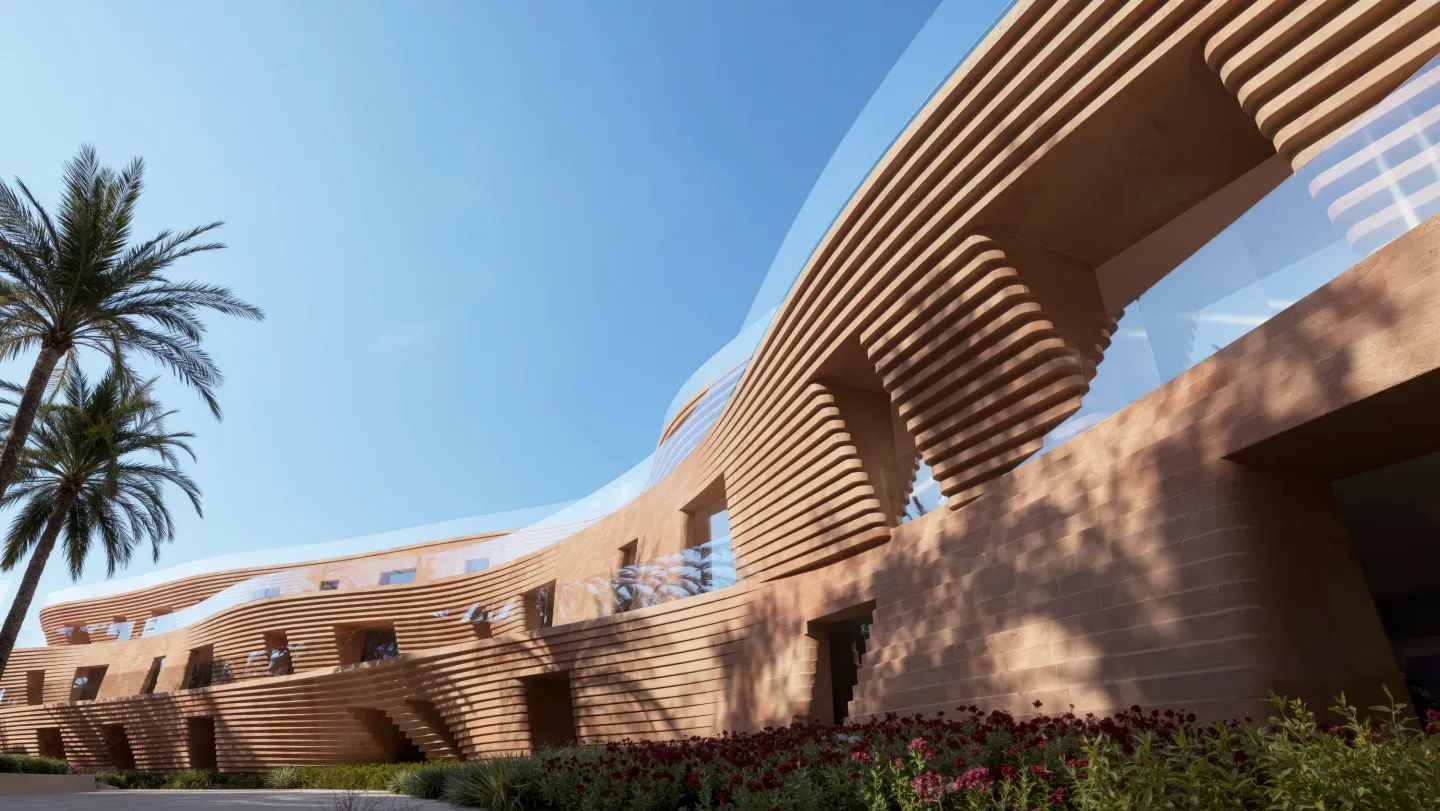 The layered, coral-inspired facade of a Mira Coral Bay residence against a blue sky
